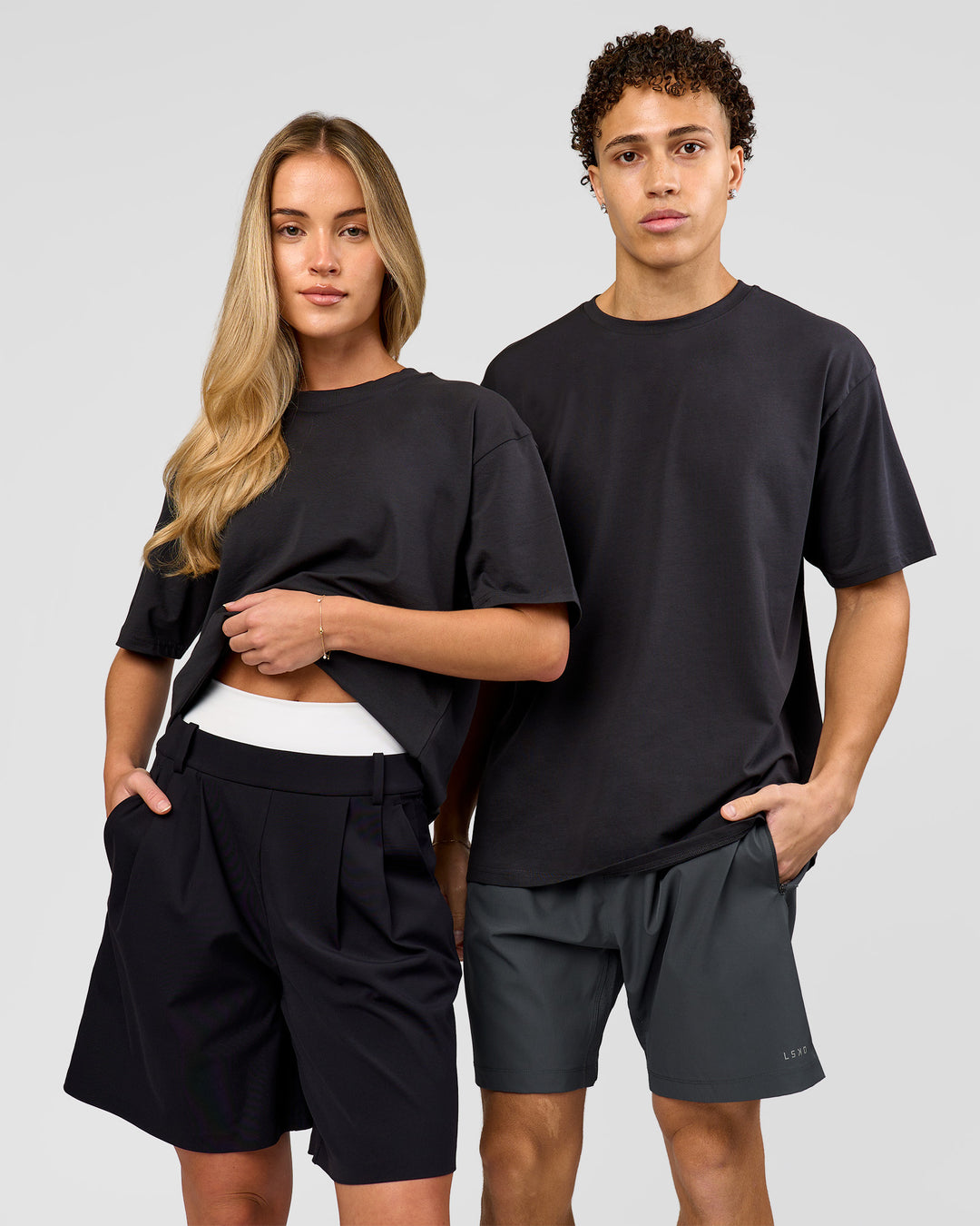 Duo wearing Benchmark FLXCotton Oversized Tee - Onyx-Yellow Fizz | Model:Issy | Size:XS | Model:Leandro | Size:M - view 2