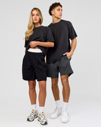 Duo wearing Benchmark FLXCotton Oversized Tee - Onyx-Yellow Fizz | Model:Issy | Size:XS | Model:Leandro | Size:M | Thumbnail Index: 4