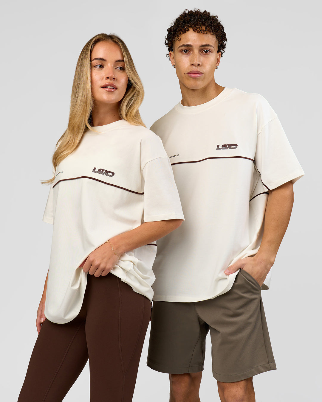 Duo wearing Inline Heavyweight FLXCotton Oversized Tee - Off White-Hot Chocolate | Model:Issy | Size:XS | Model:Leandro | Size:M - view 2