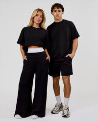 Duo wearing Shadow Mark Heavyweight Oversized Tee - Black-Onyx | Model:Issy | Size:XS | Model:Leandro | Size:M | Thumbnail Index: 3