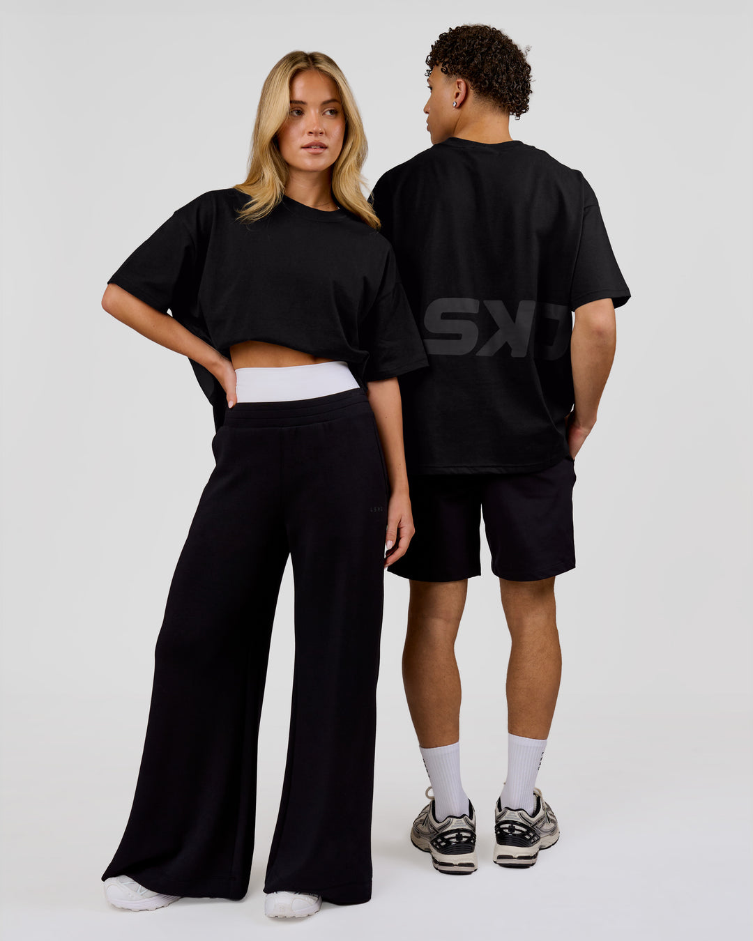 Duo wearing Shadow Mark Heavyweight Oversized Tee - Black-Onyx | Model:Issy | Size:XS | Model:Leandro | Size:M - view 10