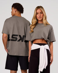 Duo wearing Shadow Mark Heavyweight Oversized Tee - Storm Front-Onyx | Model:Issy | Size:XS | Model:Leandro | Size:M | Thumbnail Index: 0