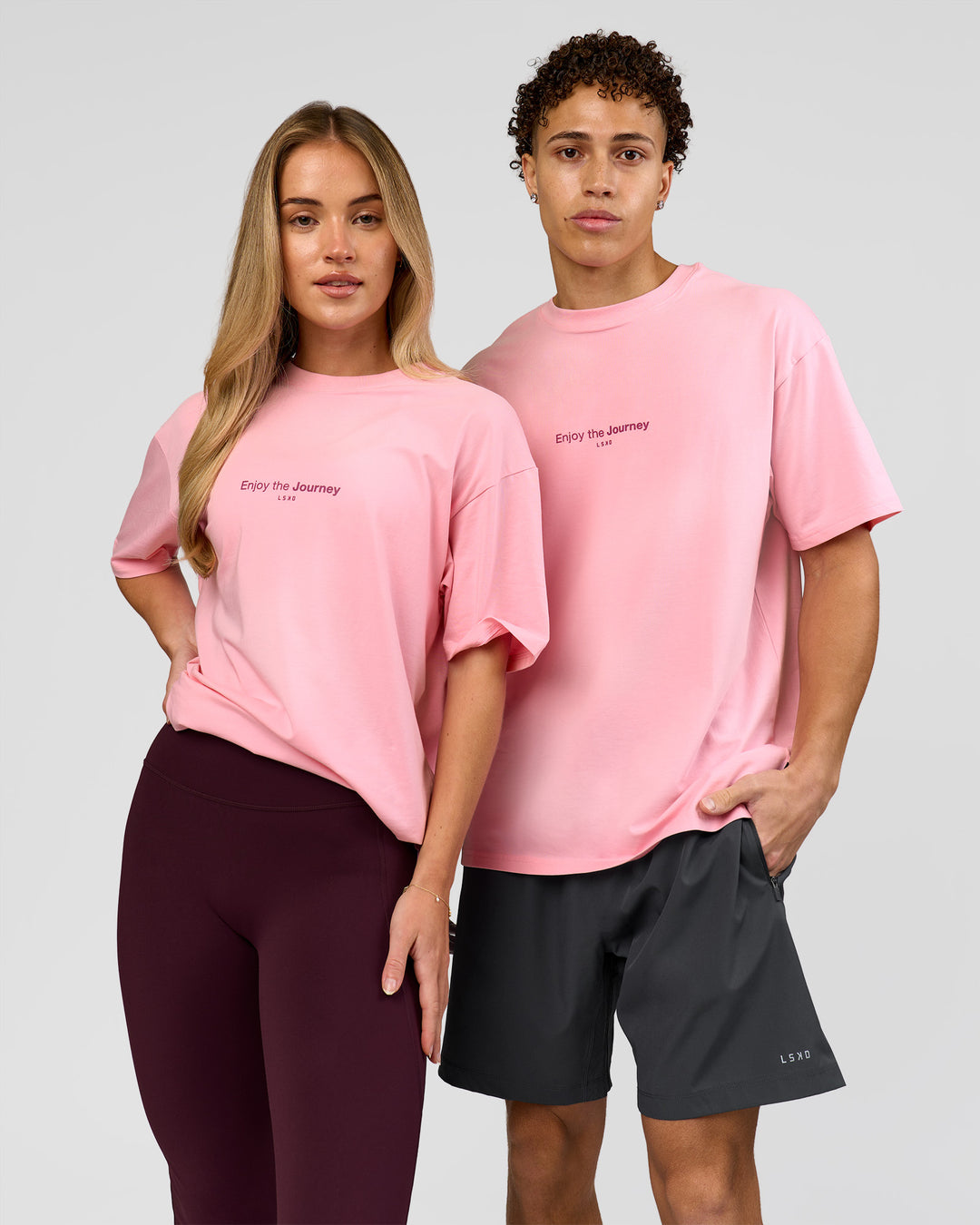 Duo wearing VS1 Enjoy The Journey FLXCotton Oversize Tee - Pink Rose | Model:Issy | Size:XS | Model:Leandro | Size:M - view 1