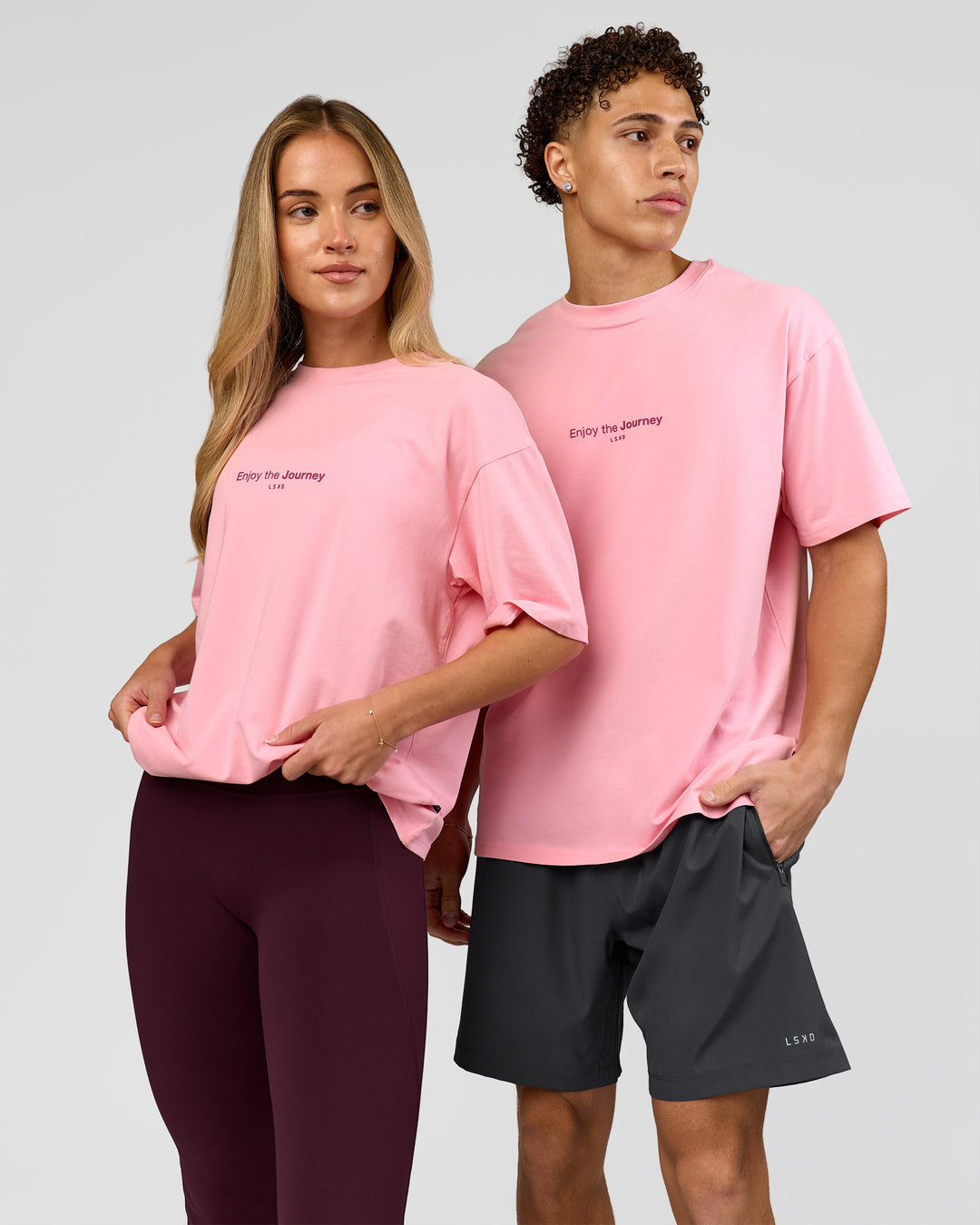 Duo wearing VS1 Enjoy The Journey FLXCotton Oversize Tee - Pink Rose | Model:Issy | Size:XS | Model:Leandro | Size:M - view 7
