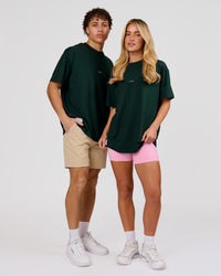 Duo wearing VS26 MFBS FLXCotton Oversize Tee - Midnight Green-Pink Rose | Model:Issy | Size:XS | Model:Leandro | Size:M | Thumbnail Index: 3