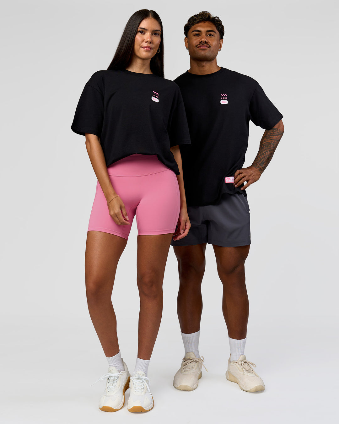 Duo wearing Archive FLXCotton Oversized Tee - Black-Candy Pink | Model:Rhiley | Size:XS | Model:Xav | Size:L - view 7