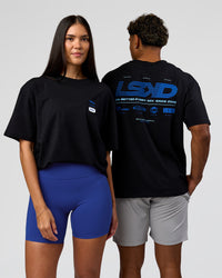 Duo wearing Archive FLXCotton Oversized Tee - Black-Electric Indigo | Model:Rhiley | Size:XS | Model:Xav | Size:L | Thumbnail Index: 0