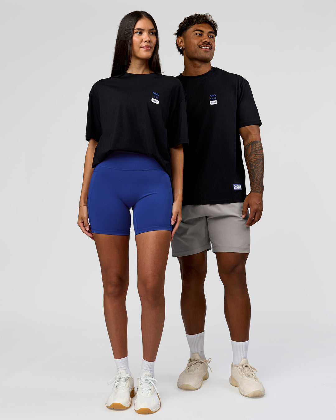Duo wearing Archive FLXCotton Oversized Tee - Black-Electric Indigo | Model:Rhiley | Size:XS | Model:Xav | Size:L - view 7
