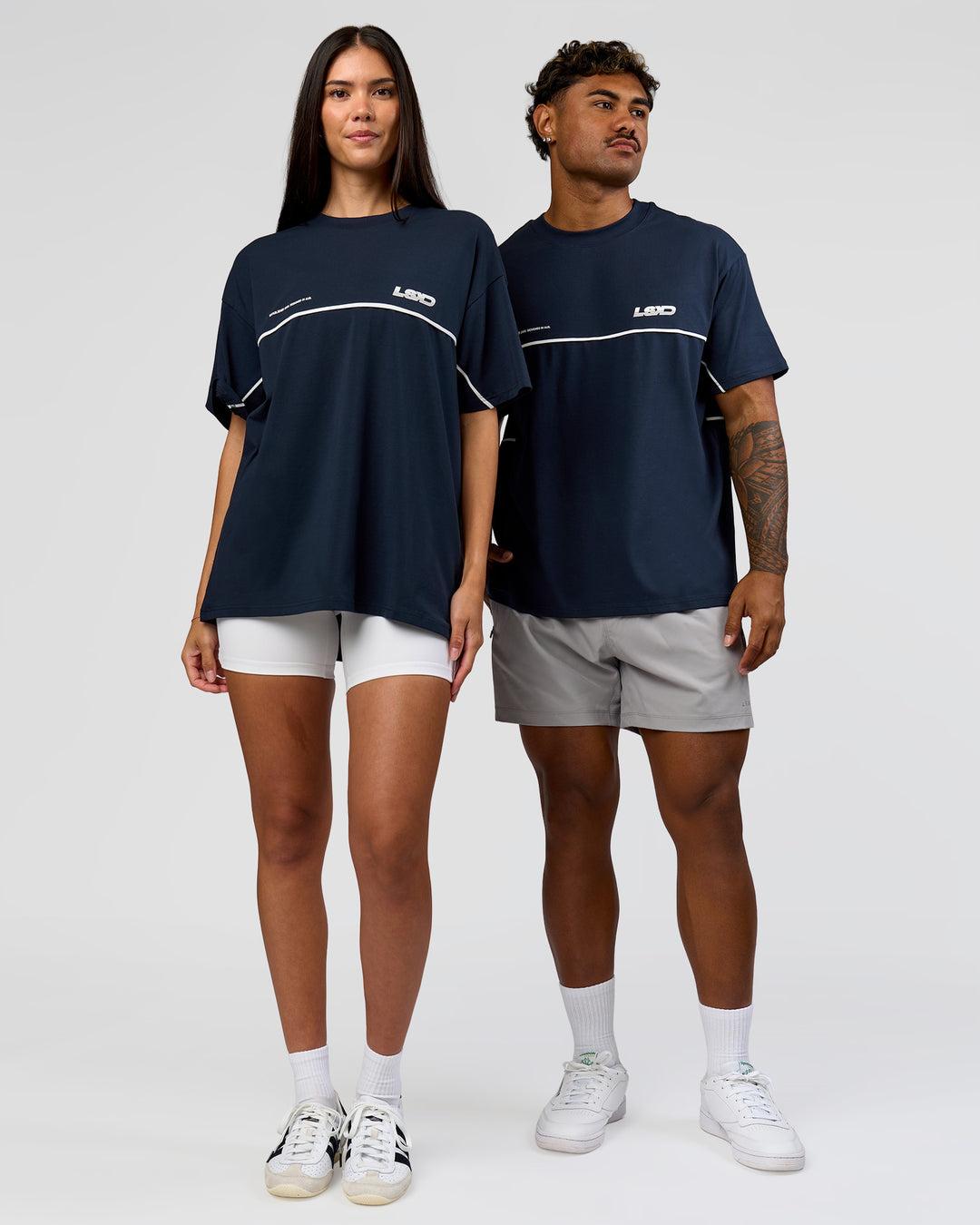Duo wearing Inline Heavyweight FLXCotton Oversized Tee - Midnight Navy-White | Model:Rhiley | Size:XS | Model:Xav | Size:L - view 7