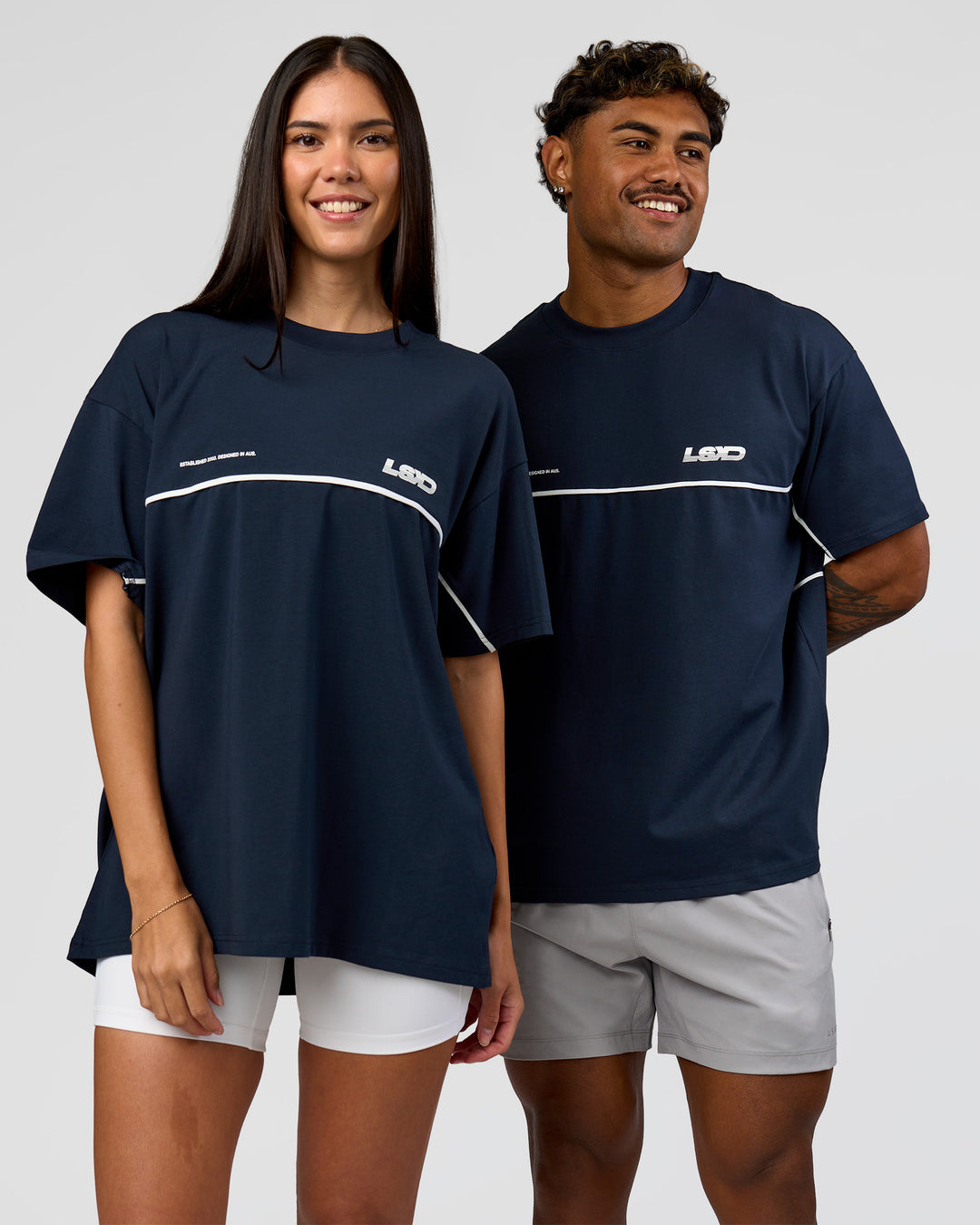 Duo wearing Inline Heavyweight FLXCotton Oversized Tee - Midnight Navy-White | Model:Rhiley | Size:XS | Model:Xav | Size:L - view 8