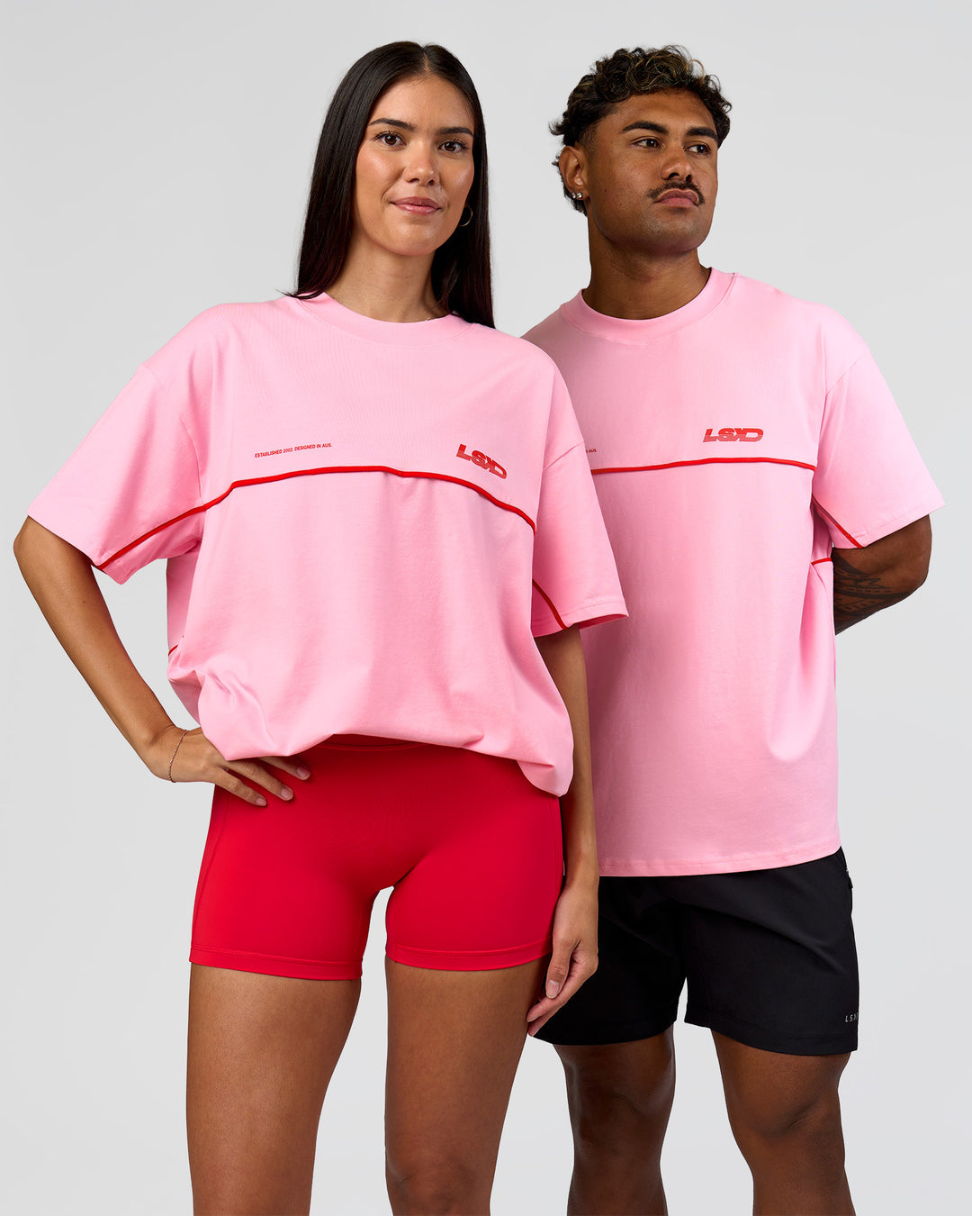 Duo wearing Inline Heavyweight FLXCotton Oversized Tee - Pink Rose-Flame | Model:Rhiley | Size:XS | Model:Xav | Size:L - view 10