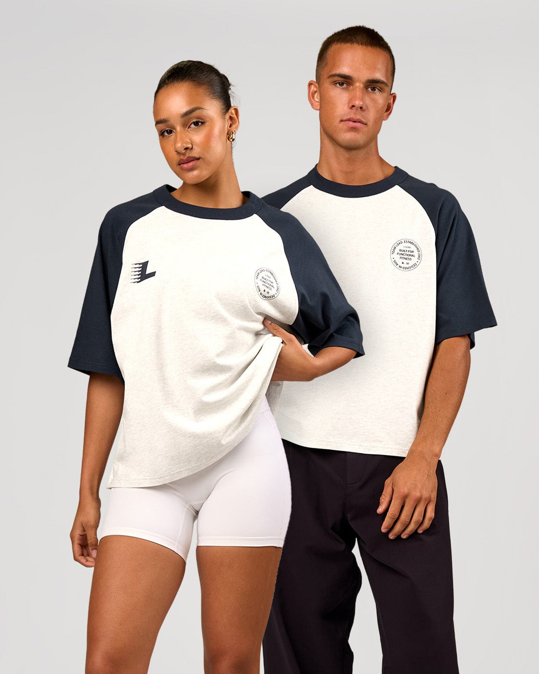 Duo wearing Victory Heavyweight Boxed Raglan Tee - Silver Marl-Midnight Navy | Model:Rosie | Size:XS | Model:Albert | Size:M