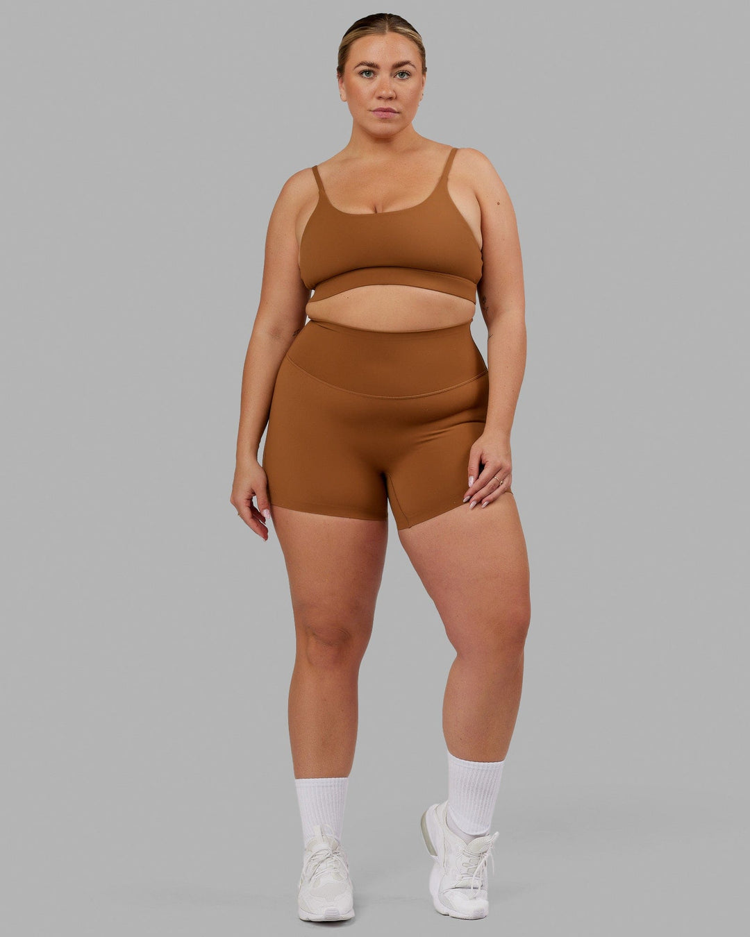 Woman wearing Elixir Sports Bra - Camel