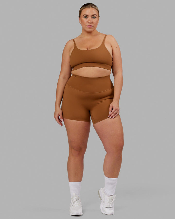 Woman wearing Elixir Sports Bra - Camel
