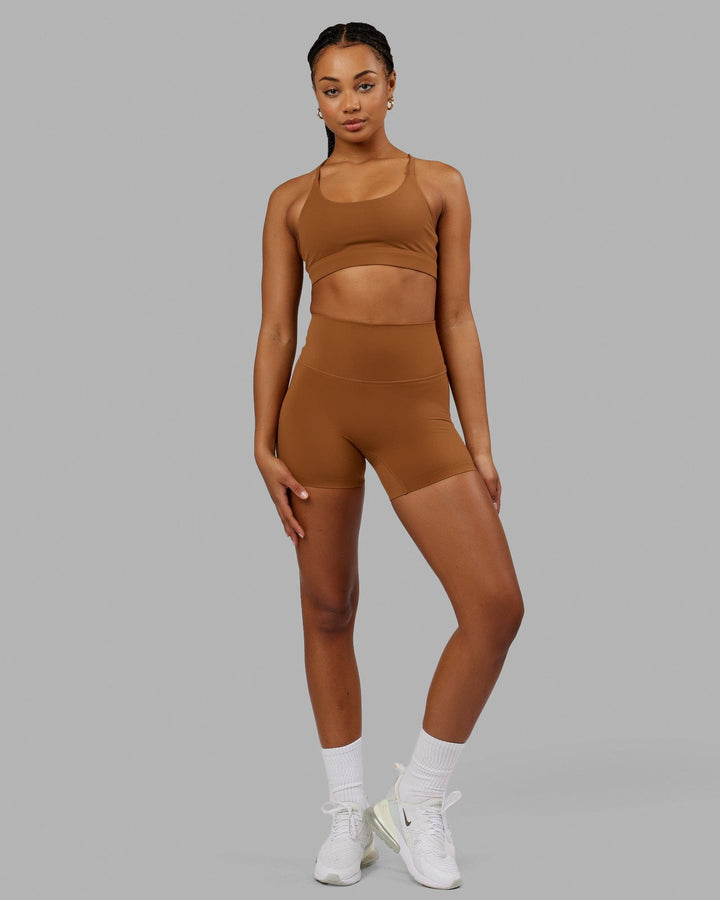 Woman wearing Elixir Sports Bra - Camel