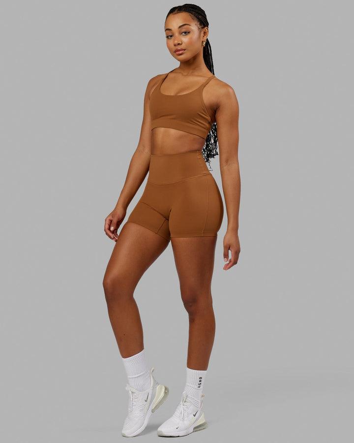 Woman wearing Elixir Sports Bra - Camel