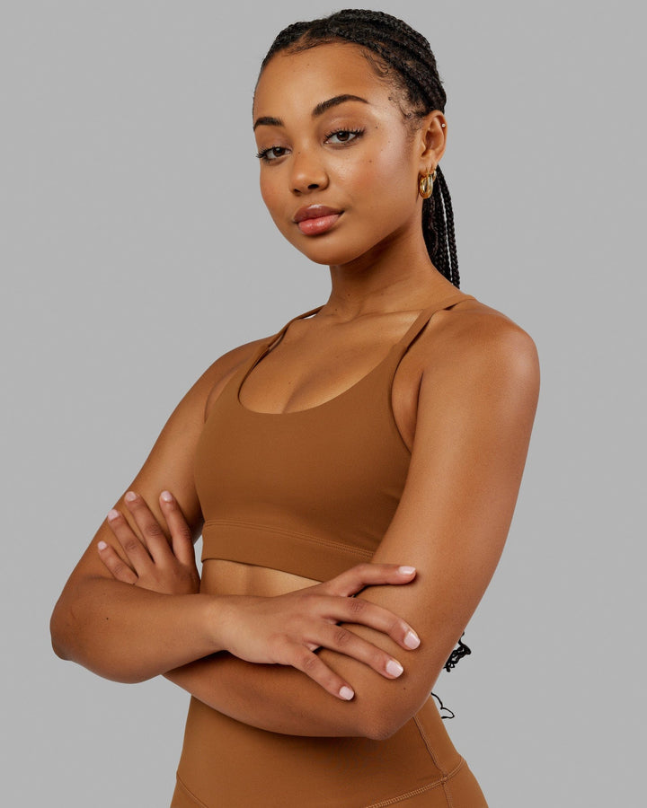 Woman wearing Elixir Sports Bra - Camel