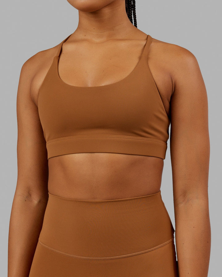 Woman wearing Elixir Sports Bra - Camel