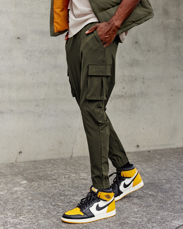 Man wearing Energy Stretch Performance Cargo Joggers - Forest Night