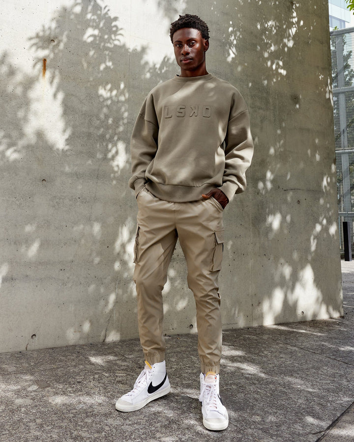 Man wearing Energy Stretch Performance Cargo Joggers - Laurel Oak
