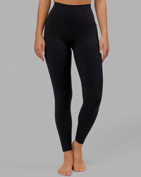 Woman wearing O.G. Fusion Ultra High-Rise Full Length Legging Pockets - Black | Model:Milly | Size:S