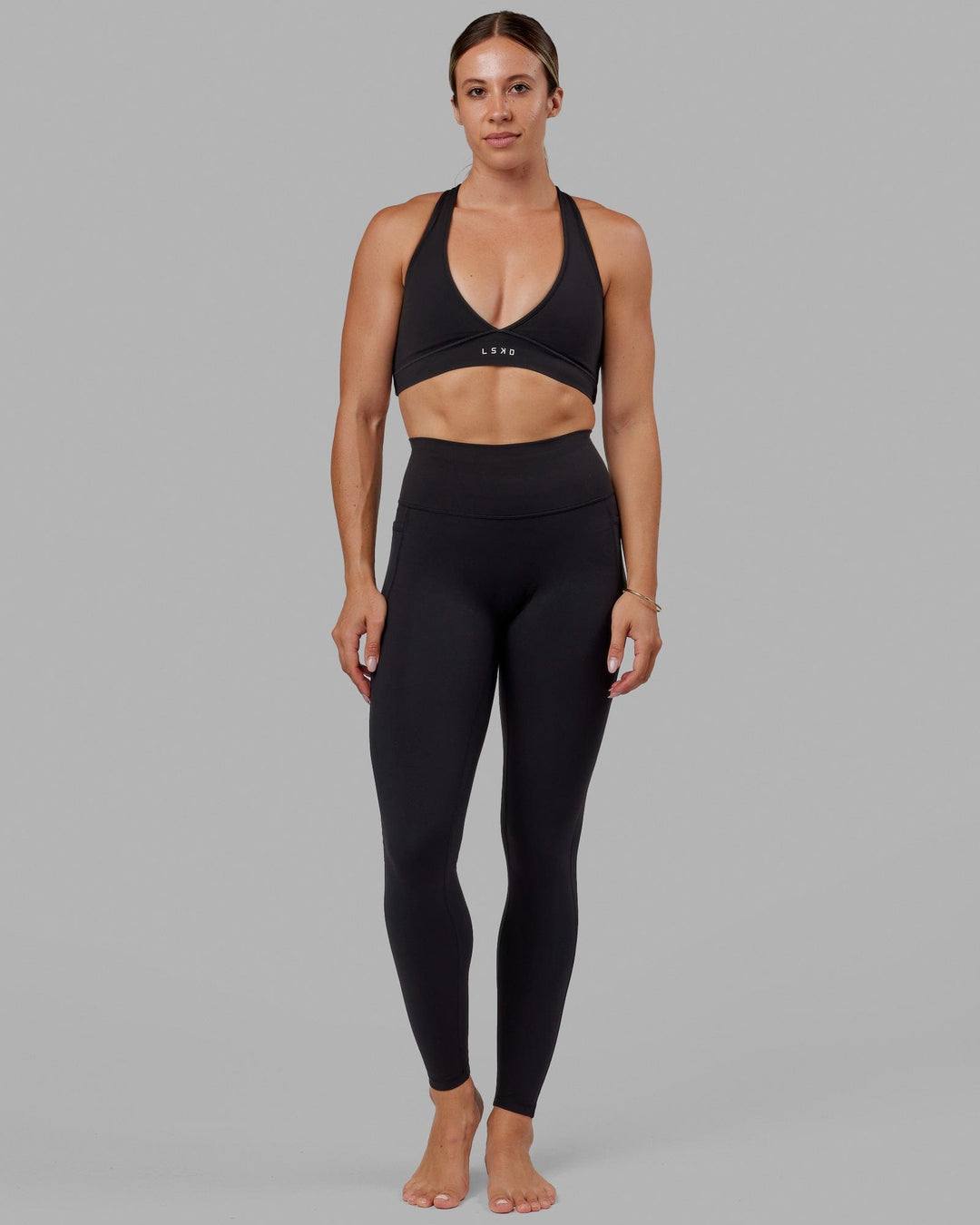 Woman wearing O.G. Fusion Ultra High-Rise Tall Legging Pockets - Black | Model:Bree | Size:S