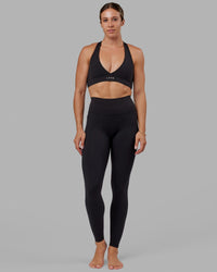 Woman wearing O.G. Fusion Ultra High-Rise Tall Legging Pockets - Black | Model:Bree | Size:S