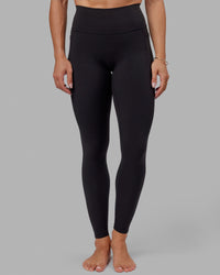 Woman wearing O.G. Fusion Ultra High-Rise Tall Legging Pockets - Black | Model:Bree | Size:S