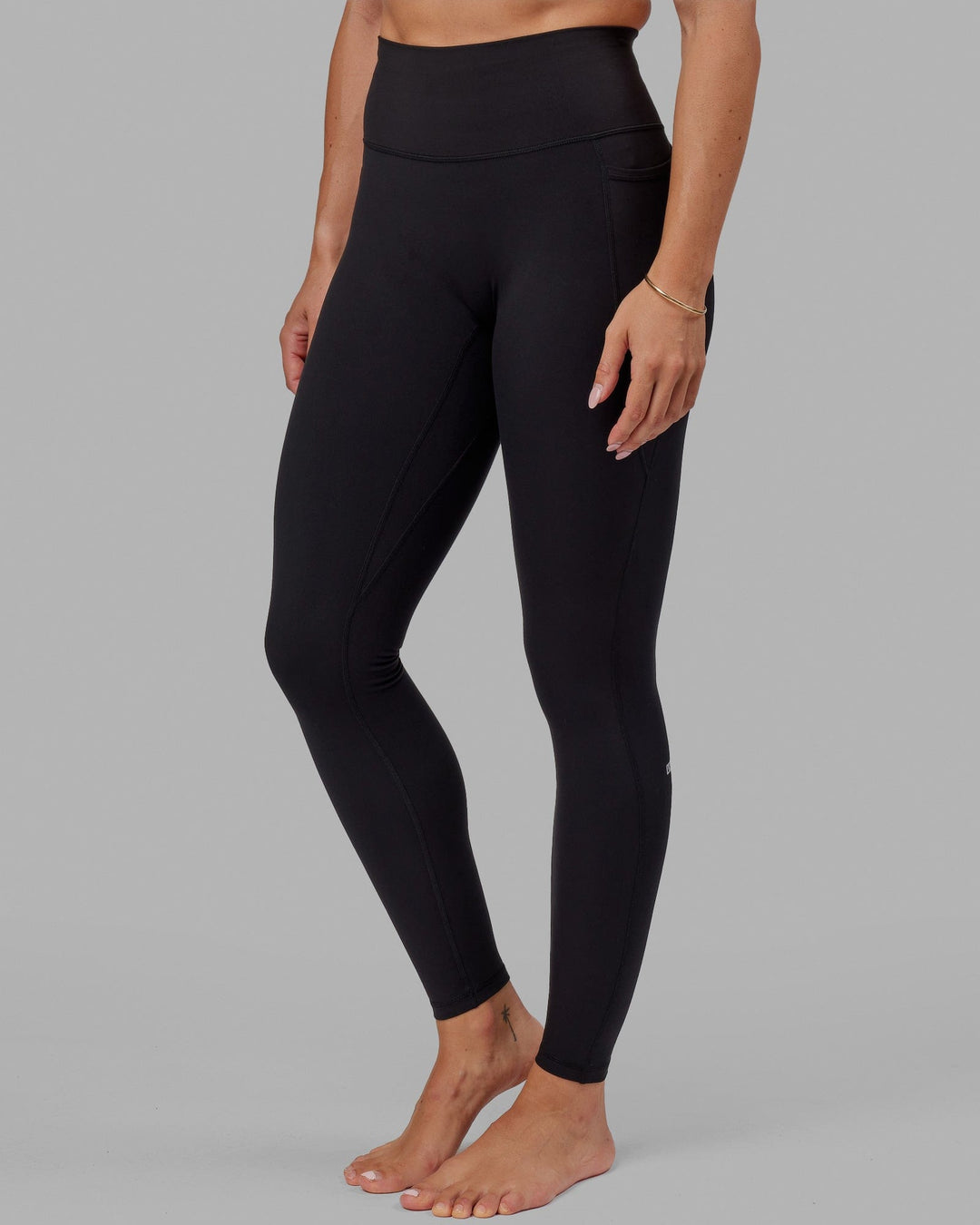 Woman wearing O.G. Fusion Ultra High-Rise Tall Legging Pockets - Black | Model:Bree | Size:S