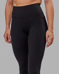 Woman wearing O.G. Fusion Ultra High-Rise Tall Legging Pockets - Black | Model:Bree | Size:S