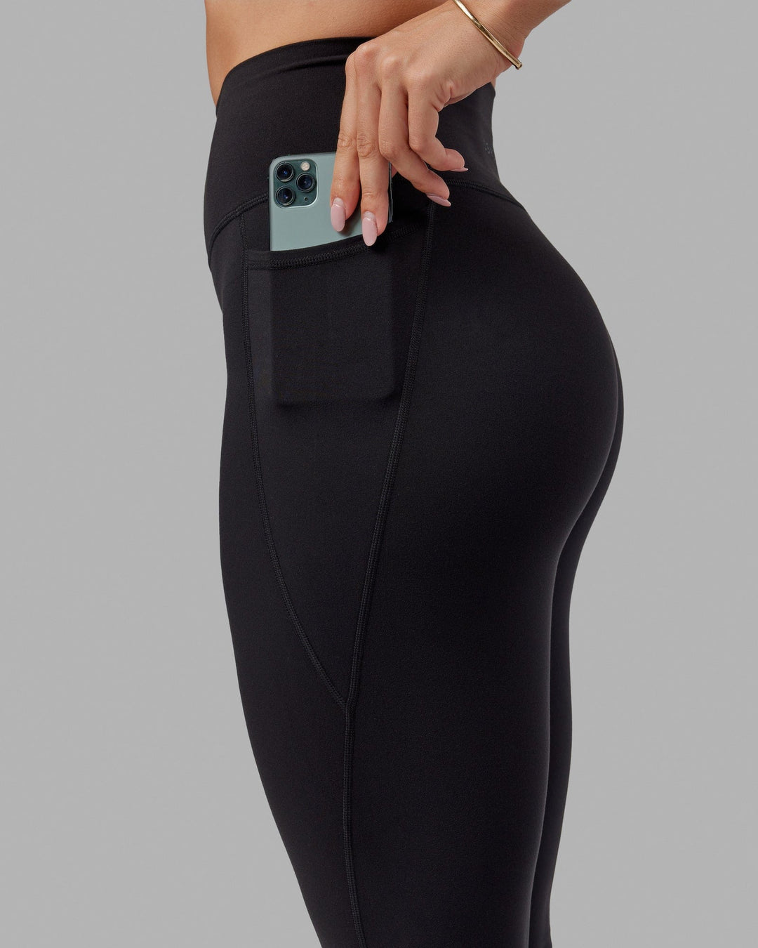 Woman wearing O.G. Fusion Ultra High-Rise Tall Legging Pockets - Black | Model:Bree | Size:S