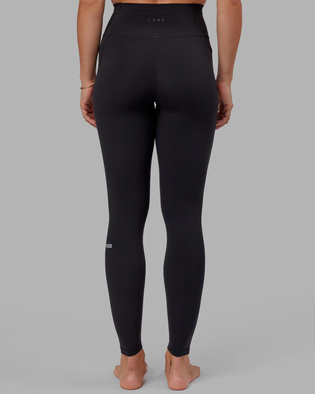 Woman wearing O.G. Fusion Ultra High-Rise Tall Legging Pockets - Black | Model:Bree | Size:S