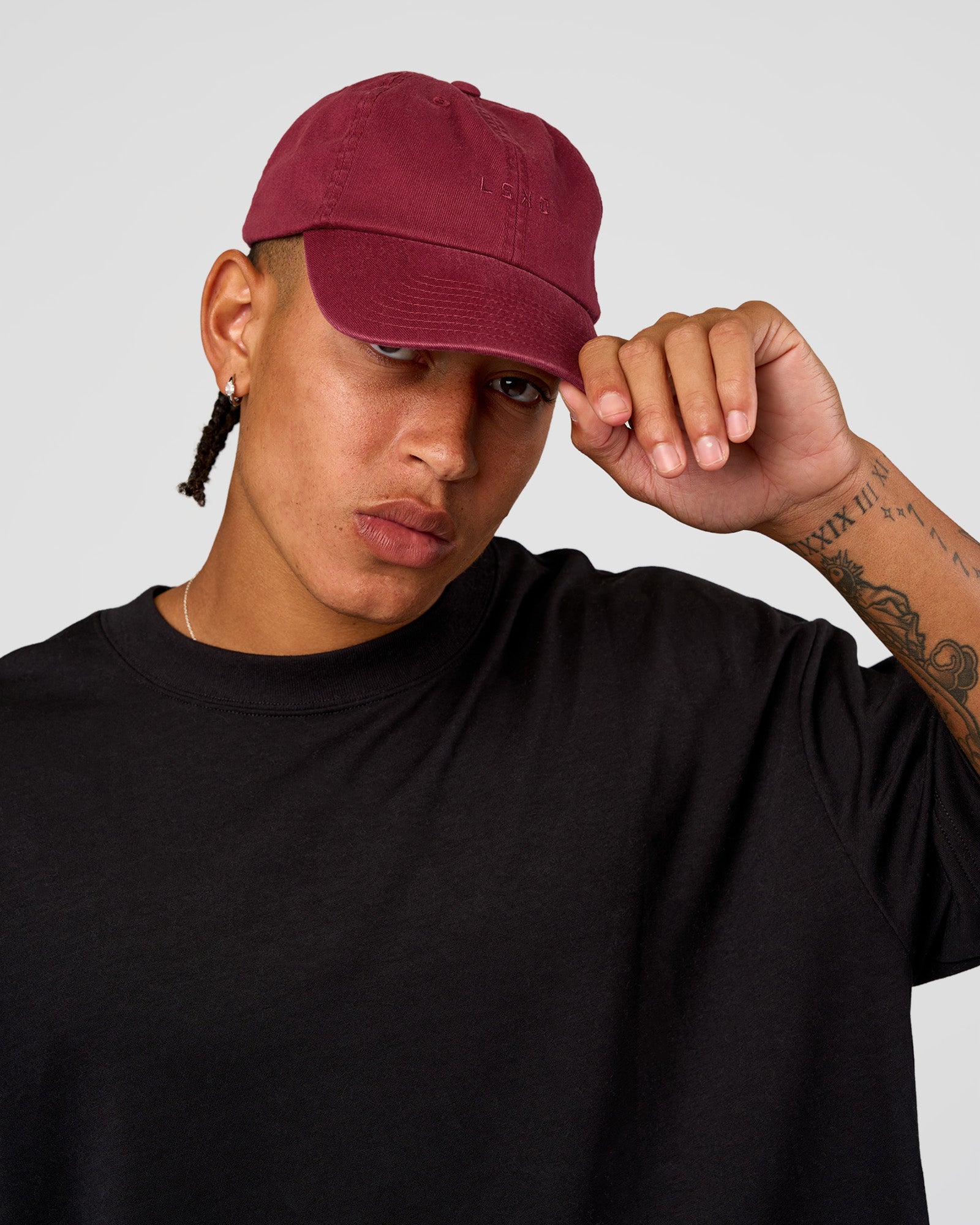 Man wearing All Day Cap - Cherry Lacquer | Model:Day | Size:ALL
