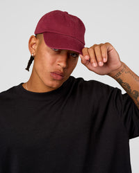Man wearing All Day Cap - Cherry Lacquer | Model:Day | Size:ALL | Thumbnail Index: 0