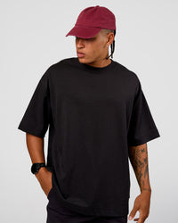 Man wearing All Day Cap - Cherry Lacquer | Model:Day | Size:ALL | Thumbnail Index: 2