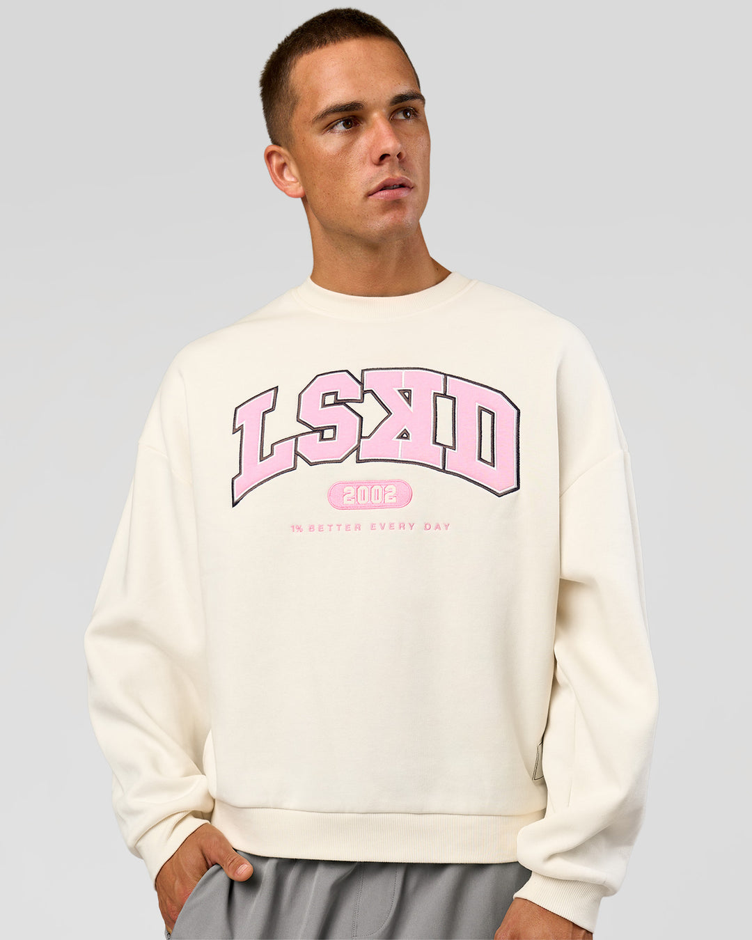 Man wearing Varsity Boxy Crew - Off White-Pink Rose | Model:Albert | Size:L