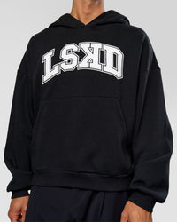 Man wearing Varsity Boxy Hoodie - Caviar-White | Model:Albert | Size:L