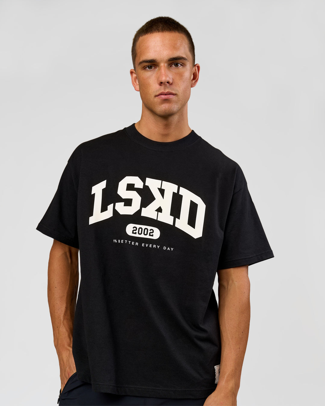 Man wearing Varsity EST Heavyweight Oversized Tee  - Black-Off White | Model:Albert | Size:L