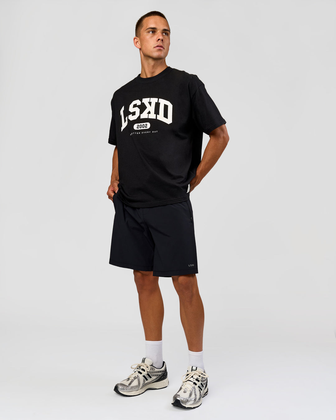 Man wearing Varsity EST Heavyweight Oversized Tee  - Black-Off White | Model:Albert | Size:L