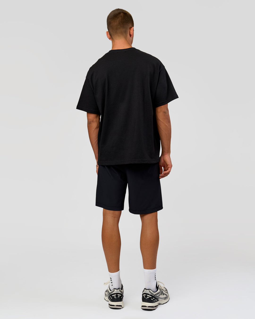 Man wearing Varsity EST Heavyweight Oversized Tee  - Black-Off White | Model:Albert | Size:L