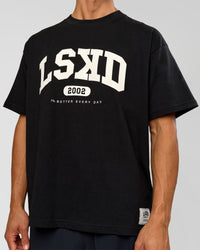 Man wearing Varsity EST Heavyweight Oversized Tee  - Black-Off White | Model:Albert | Size:L