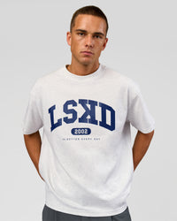 Man wearing Varsity EST Heavyweight Oversized Tee  - Silver Marl-Future Navy | Model:Albert | Size:L