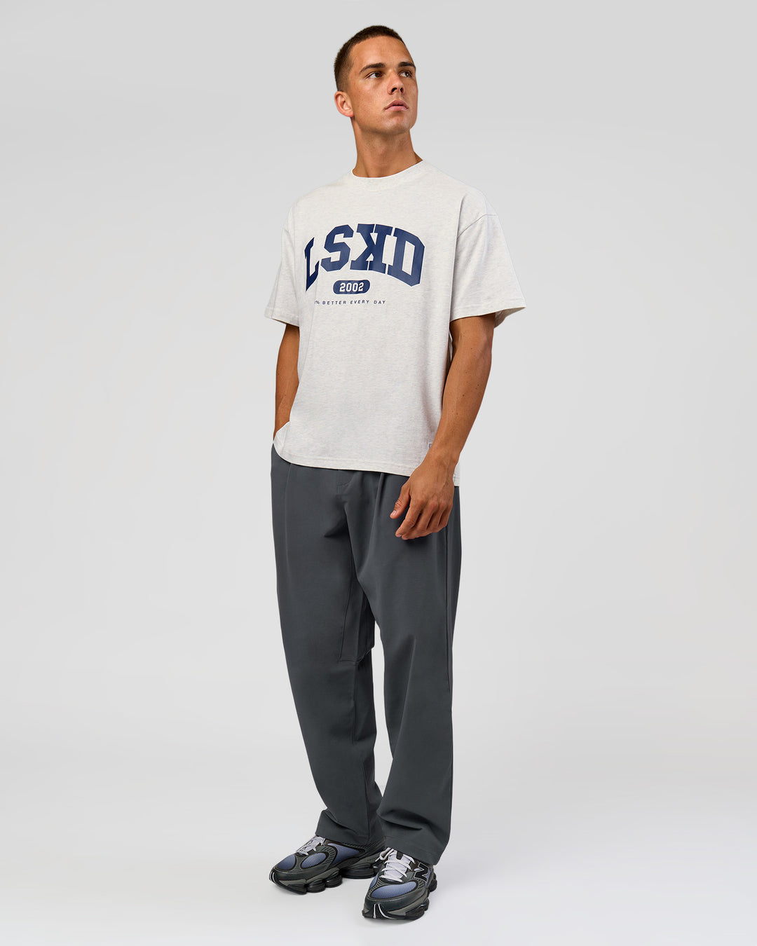 Man wearing Varsity EST Heavyweight Oversized Tee  - Silver Marl-Future Navy | Model:Albert | Size:L