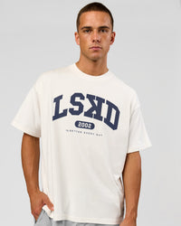 Man wearing Varsity EST Heavyweight Oversized Tee  - Off White-Future Navy | Model:Albert | Size:L