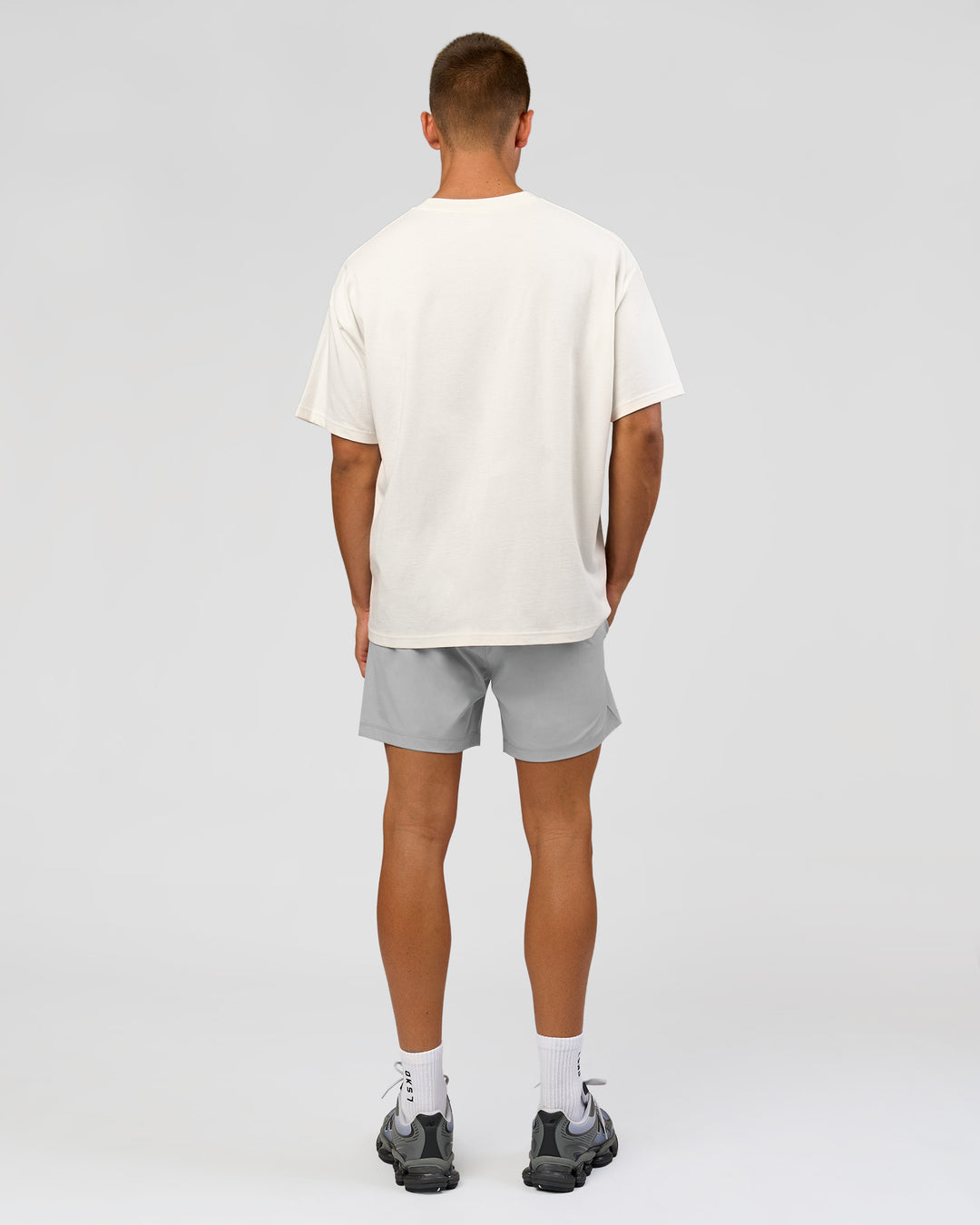 Man wearing Varsity EST Heavyweight Oversized Tee  - Off White-Future Navy | Model:Albert | Size:L