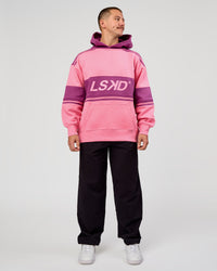 Man wearing A-Team Oversized Hoodie - Candy Pink-Boysenberry | Model:Jaiden | Size:L | Thumbnail Index: 7