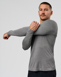Man wearing AeroFLX+ Seamless Long Sleeve Tee (Set in Sleeve) - Dark Storm/Alloy | Model:Jaiden | Size:L | Thumbnail Index: 0