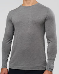 Man wearing AeroFLX+ Seamless Long Sleeve Tee (Set in Sleeve) - Dark Storm/Alloy | Model:Jaiden | Size:L | Thumbnail Index: 1