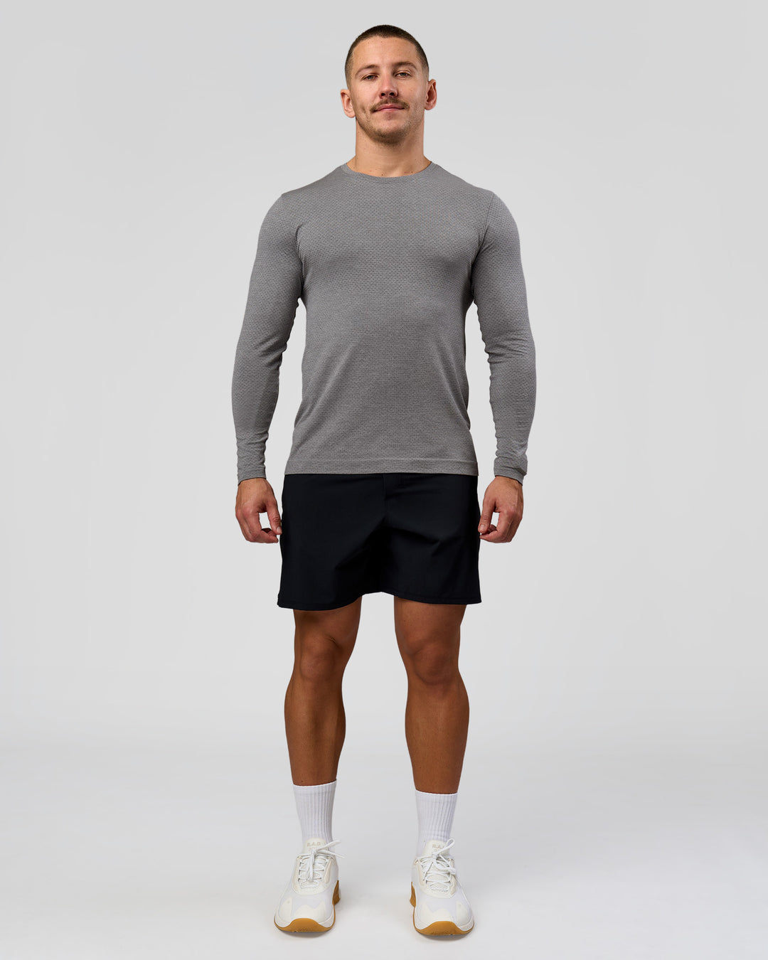 Man wearing AeroFLX+ Seamless Long Sleeve Tee (Set in Sleeve) - Dark Storm/Alloy | Model:Jaiden | Size:L - view 4