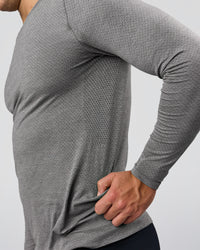 Man wearing AeroFLX+ Seamless Long Sleeve Tee (Set in Sleeve) - Dark Storm/Alloy | Model:Jaiden | Size:L | Thumbnail Index: 5